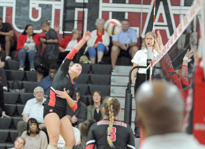 Lake Highland Prep outside hitter Kayden Green goes for one of her eight kills against Boca Raton St. Andrew's. Green also had 10 digs to help the Highlanders win 25-8, 25-15, 25-21 in the Region 2-3A volleyball final.